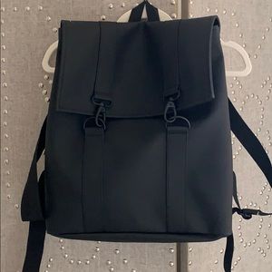 Rains black waterproof backpack